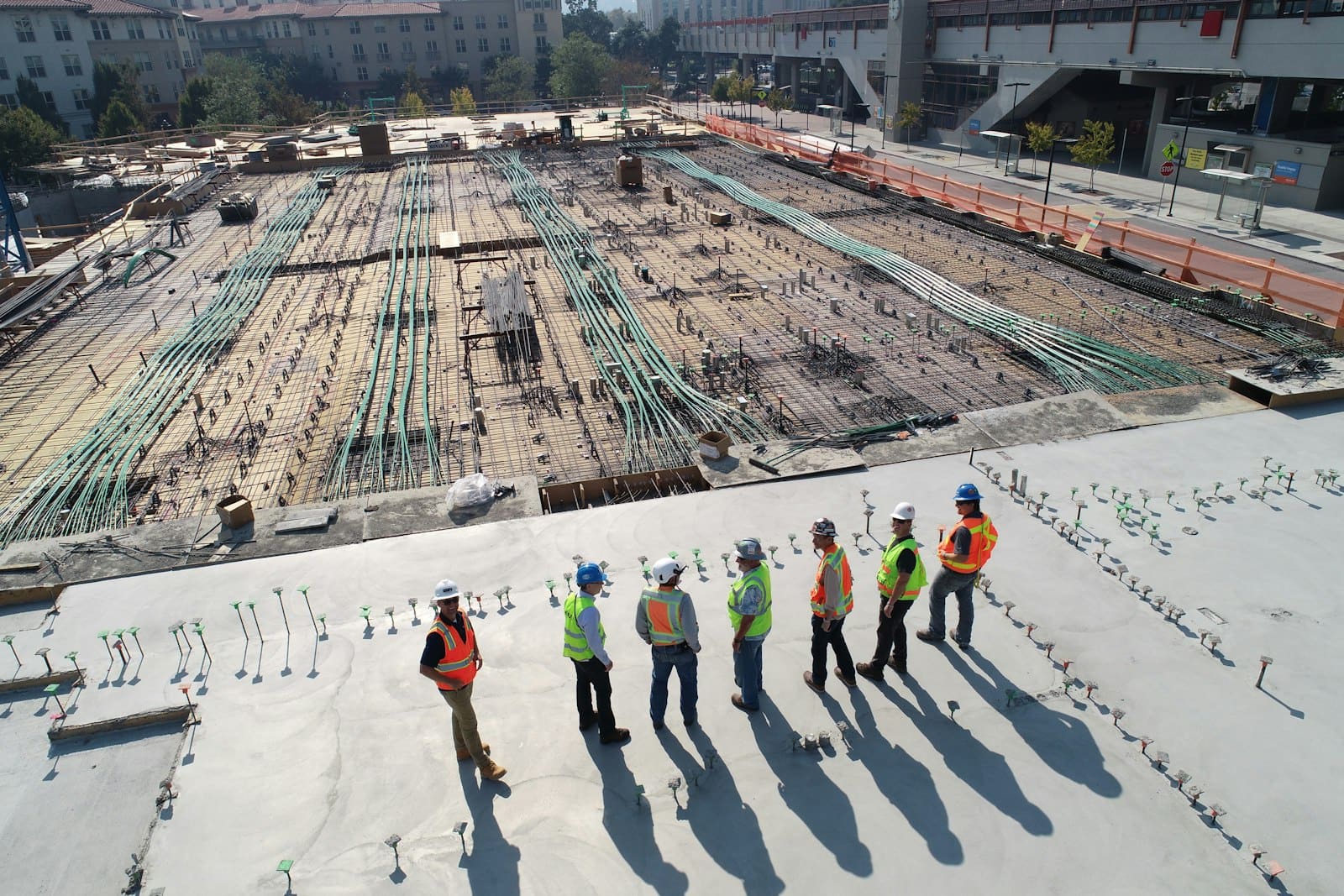 Concrete contractor crew finishing a reinforced residential slab in Rochester, NH