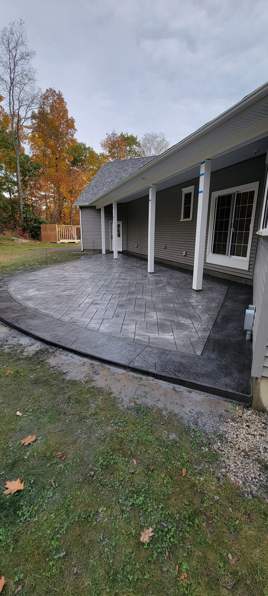 Stamped concrete patio with decorative finish in a New Hampshire home