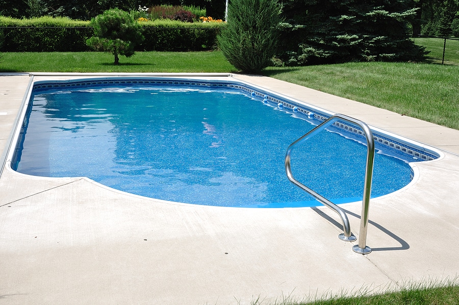 Pool patio with light concrete finish for heat reduction