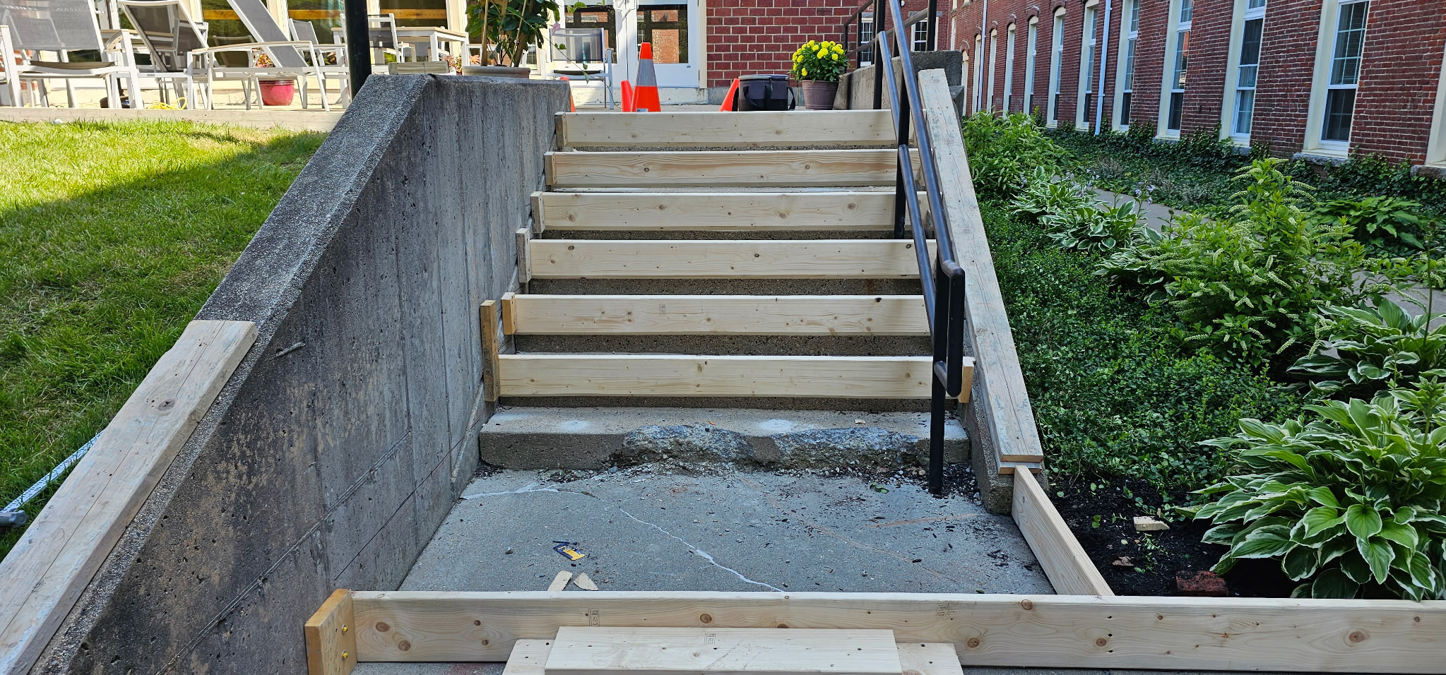 Concrete stairs with retaining wall at commercial building