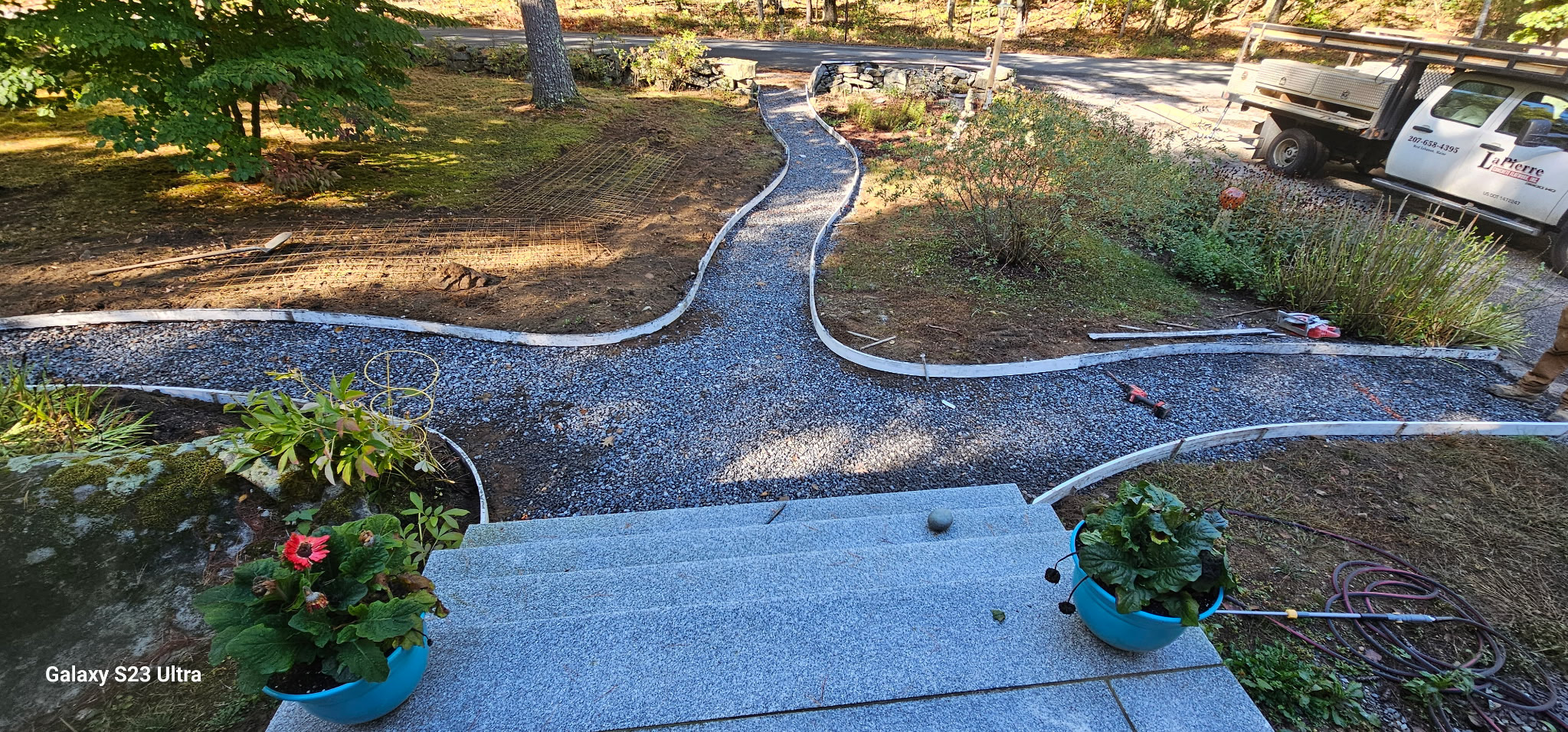 Curved concrete walkway with steps
